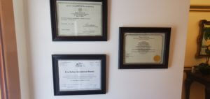 Awards and certificates mounted on a wall